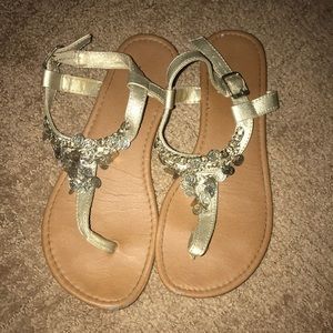 Golden sandals with golden circles